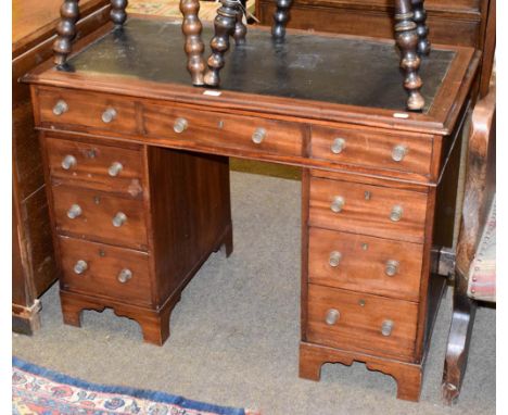 An Edwardian mahogany twin pedestal writing desk with brass handles, 105cm by 57cm by 76cm