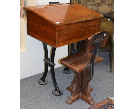 A Victorian pine and cast iron school desk with matching chair, by repute from Stoney Hirst College, Lancashire, 65cm by 50cm