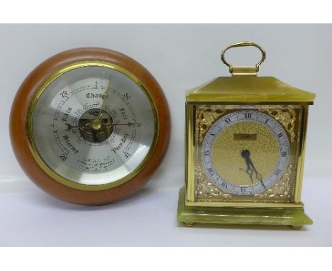 A James Walker brass and onyx clock and a Comitti of London barometer