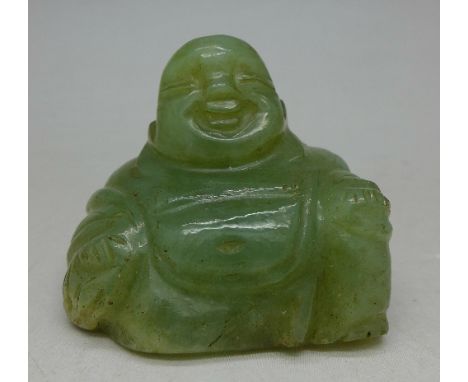 A carved jade figure of Buddha, height 4cm