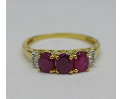 A silver gilt set African ruby and baguette diamond ring, S