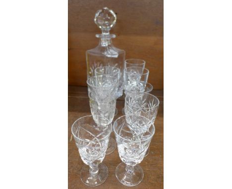 A crystal decanter and nine glasses including Georgian, Victorian and later