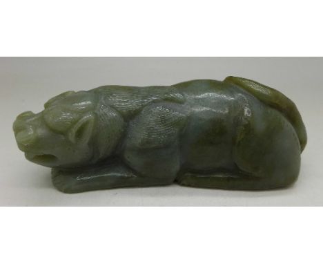 A carved jade figure, length 12.5cm