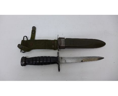 An American bayonet with scabbard, the bayonet marked U.S. M4 Imperial, the scabbard marked U.S. M8A1, B.M. Co.