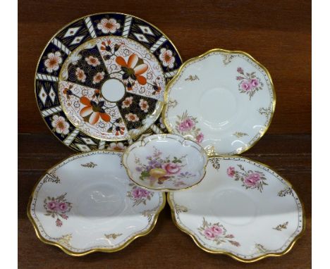 A Royal Crown Derby 2451 pattern plate, three Royal Crown Derby Royal Pinxton Roses saucers, seconds, and a Derby Posies dish