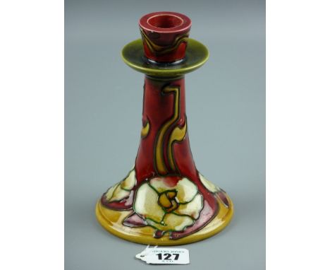 A Minton Secessionist single candlestick having a stylized tube lined floral pattern by designers John Wadsworth and Leon Sol