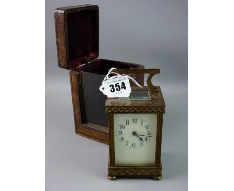 A late 19th/early 20th Century French carriage clock, stamped to the rear 'R & Co, Made in Paris', a plain full panel dial se