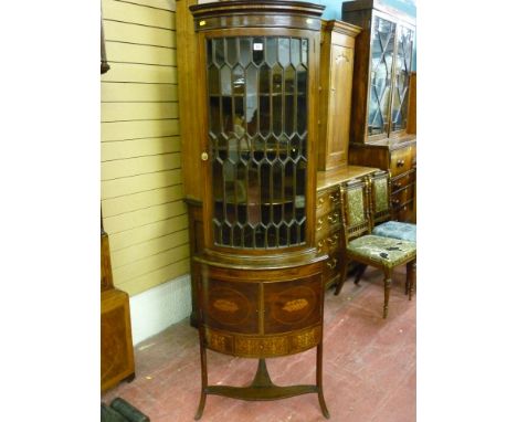 A 19th Century Sheraton style inlaid corner display cabinet, the Gothic beaded multi-paned top section with shaped interior s