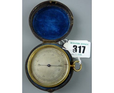 A 19th Century pocket barometer in a gilt brass case and revolving bezel and silvered dial, the rear of the case marked 'Elli
