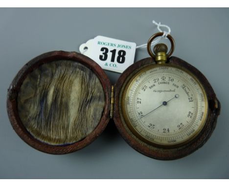 A late 19th Century silvered dial pocket barometer in a fitted case, 5 cms diameter