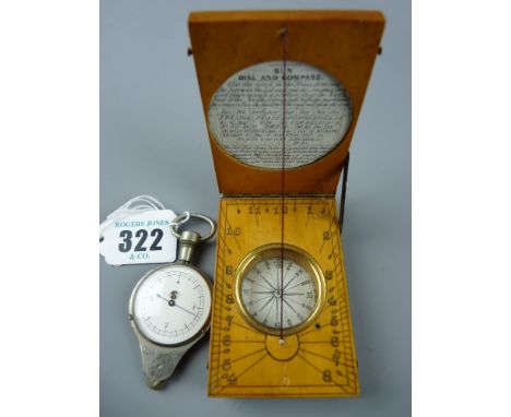 A 19th Century boxwood pocket sundial and compass with circular inset paper instruction and equation table, 7.5 x 5 cms and a