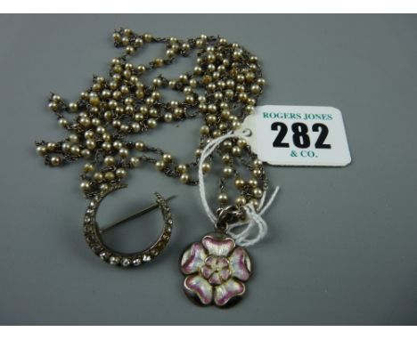 A silver and enamel English Rose pendant, Chester 1908, with a long pearl chain, 12 grms and a silver crescent brooch of grad