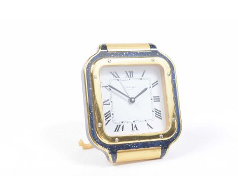 A Cartier 'Santos' travel clockThe square white enamel dial with Roman Numeral hour markers, within a bi-colour metal and lap