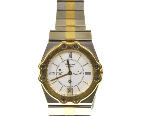 A Chopard St. Moritz wristwatchThe stainless steel case with yellow metal bezel and white dial with baton and Roman numeral h