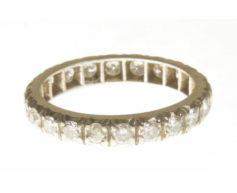 A diamond eternity ringThe brilliant cut diamond line with four claw settings, estimated total diamond weight 1.30cts, ring s