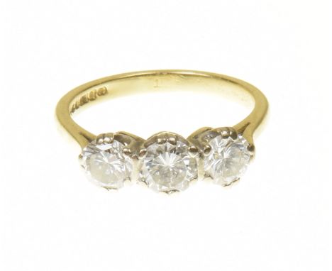 An 18ct gold diamond three stone ringThe brilliant cut diamond line with tapered shoulders, estimated total diamond weight 1.