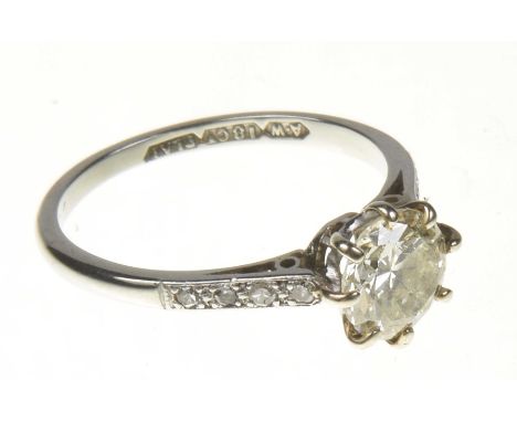A diamond single stone ringThe brilliant cut diamond within an eight claw setting with single cut diamond sides, estimated di