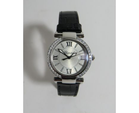 A Chopard 'Imperiale' diamond wristwatchThe circular silvered dial with Roman numeral and baton hour markers, with date apert