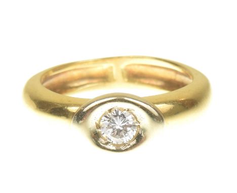 An 18ct gold diamond single stone ringThe brilliant cut diamond within a marquise shape collet atop the plain band, French as