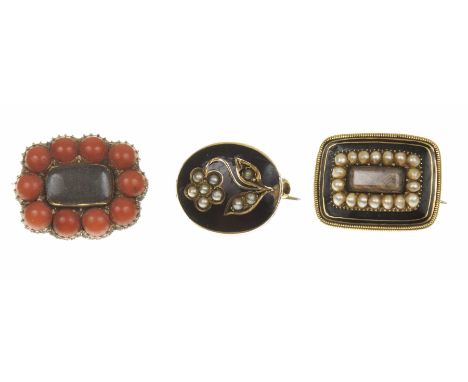Three mid Victorian memorial broochesTo include a split pearl forget-me-not within an oval shape black enamel surround, toget