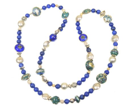 A sterling silver, enamel and lapis lazuli bead necklace.The single strand lapis lazuli bead necklace, with vari-shade enamel