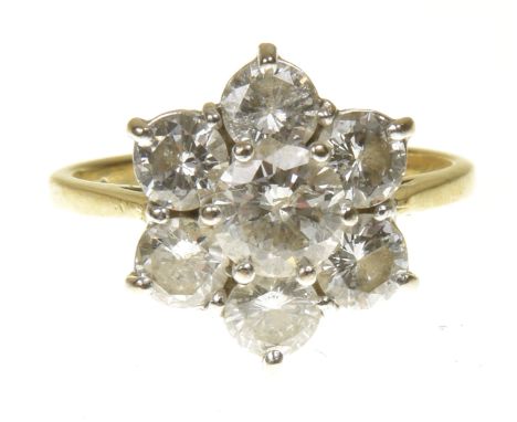 An 18ct gold diamond cluster ringThe brilliant cut diamond within a similarly cut diamond surround, estimated total diamond w