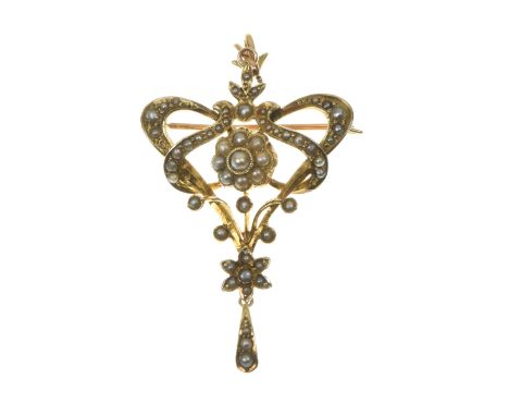 An early 20th Century split pearl broochThe split pearl floral cluster, within an openwork scrolling surround and graduated s