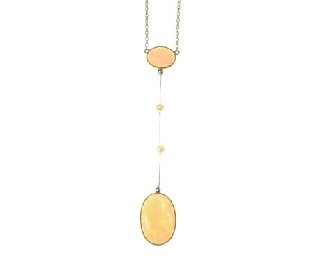 An opal and seed pearl necklaceThe oval opal cabochon drop, suspended by a seed pearl bar spacer and similar shape opal, with