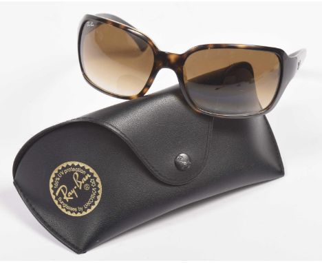 A pair of Ray-Ban sunglassesThe brown lens with a tortoiseshell-effect plastic surround, with makers case and cleaning cloth.