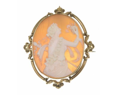 A late Victorian shell cameo broochThe oval shape shell cameo depicting Bacchante, within an openwork scrolling surround, len