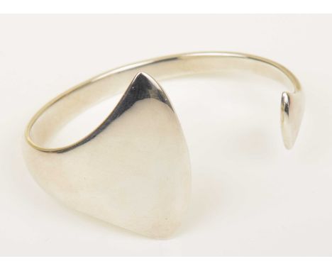 A Georg Jensen silver bangleDesigned by Bent Gabrielsen, the torque bangle with asymmetric fanned terminals, stamped Georg Je