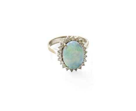 An 14 Carat White Gold Opal and Diamond Cluster Ring, the oval cabochon opal within a border of round brilliant cut diamonds,