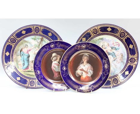 A Pair of Vienna Style Porcelain Dishes, 20th century, ground in cobalt blue and gilded, printed with Classical scenes, shiel