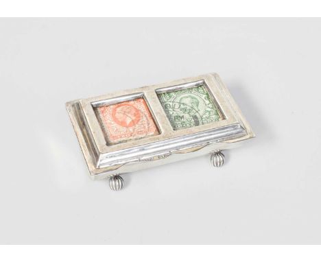 An Edward VII Silver Stamp-Box, by Grey and Co., Birmingham, 1906, oblong and on four fluted ball feet, the spring-loaded hin