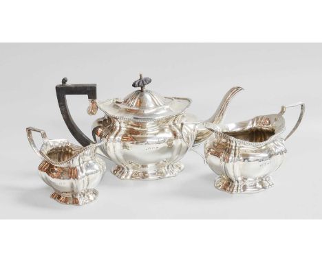 A Three-Piece Edward VII Silver Tea-Service, by John Hines, Birmingham, 1905, each piece oval and on spreading base, comprisi