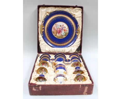 A Vienna Style Porcelain Coffee Set, in fitted case, ground in blue, gilded and printed with Classical figures, comprising: c