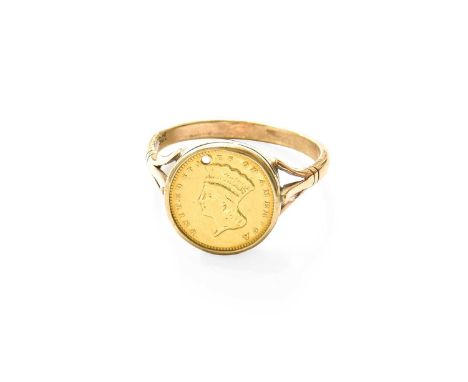 A USA 1 Dollar Ring, finger size Z+1Shank stamped '9CT', date of coin illegible due to damage to reverse. Gross weight 6.5 gr