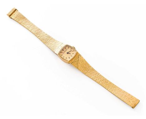 A Lady’s 9 Carat Gold Bueche Girod Wristwatch, circa 1975, manual wound movement, with a 9 carat gold integral braceletWeight