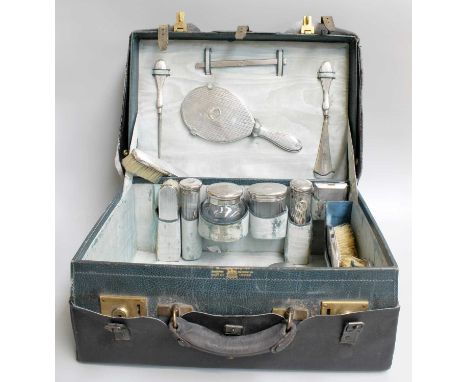 A Cased George V SilverMounted Dressing-Table Service, each piece engine-turned, engraved with either initials or a crest, co