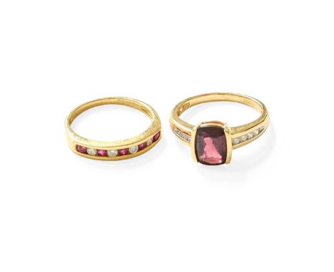 An 18 Carat Gold Garnet and Diamond Ring, the cushion cut garnet in a yellow elongated claw setting, flanked by tapered diamo