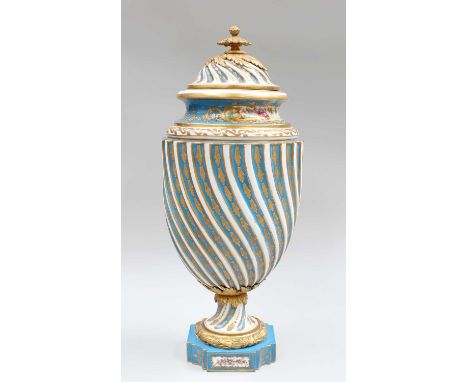 A Sèvres Style Porcelain Urn, early 20th century, wrythen moulded and with gilt metal mounts, blue celeste ground, with trail