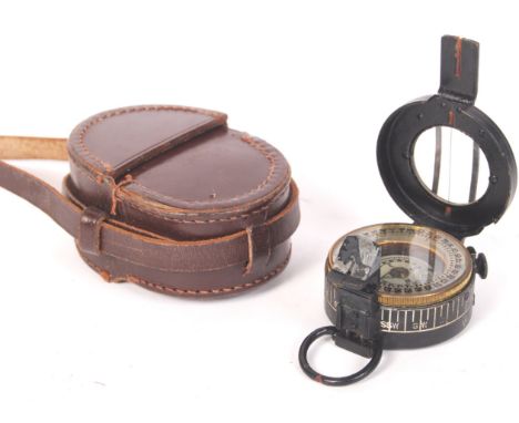 A WWII Second World War T.G Co. Ltd of London made Mk III military field compass. Dated 1944 with broad arrow. Within the ori