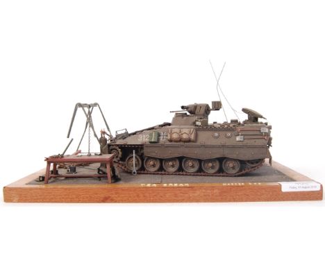 A superb museum quality military model diorama. Showing an armoured military vehicle, titled ' Tea Break '. The model being s