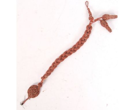 A scarce WWI First World War German / Prussian Markman's uniform lanyard. Red, white and black cord construction, with a wove