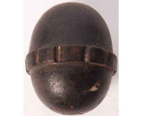 An original WWI First World War German ' egg ' grenade. Steel construction, with ribbed grips. Stamped ' F1 ' to top. Inert. 