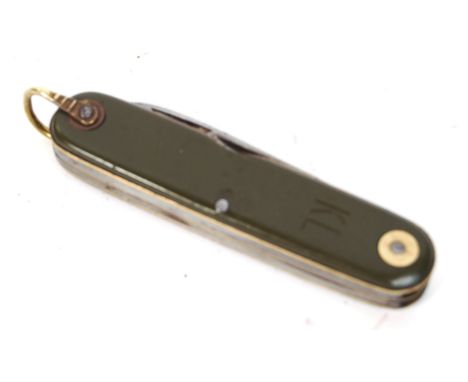 An original vintage 20th century military issue KL Dutch Swiss Army knife. Comprising of a knife, can opener and other tools.
