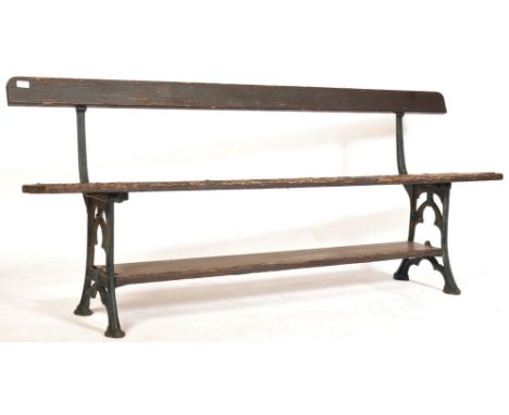 A mid-century industrial North Wales Welsh railway station bench. The cast iron bench ends having railway arch design and not