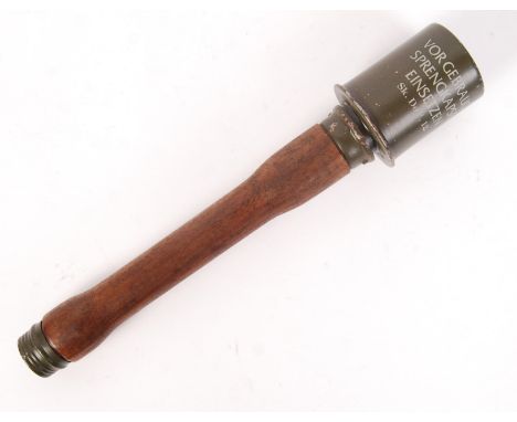 A WWII Second World War style German practice stick grenade (non-functioning). Various stamps and markings to the upper metal