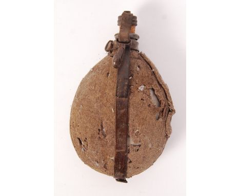 A rare WWI First World War German soldier's / infantry water bottle. Original tan canvas covering, with leather strapping. Co