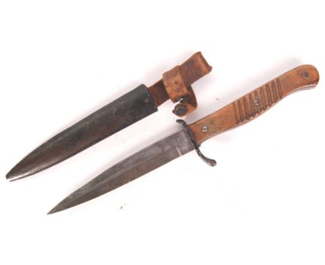 A scarce WWI First World War German fighting / trench knife. The ricasso marked for Rasiermesser Fabrik, Ern Wald Rhein. Shap